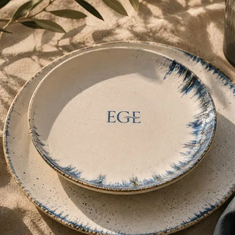 Hand-painted ceramic plates in afternoon light